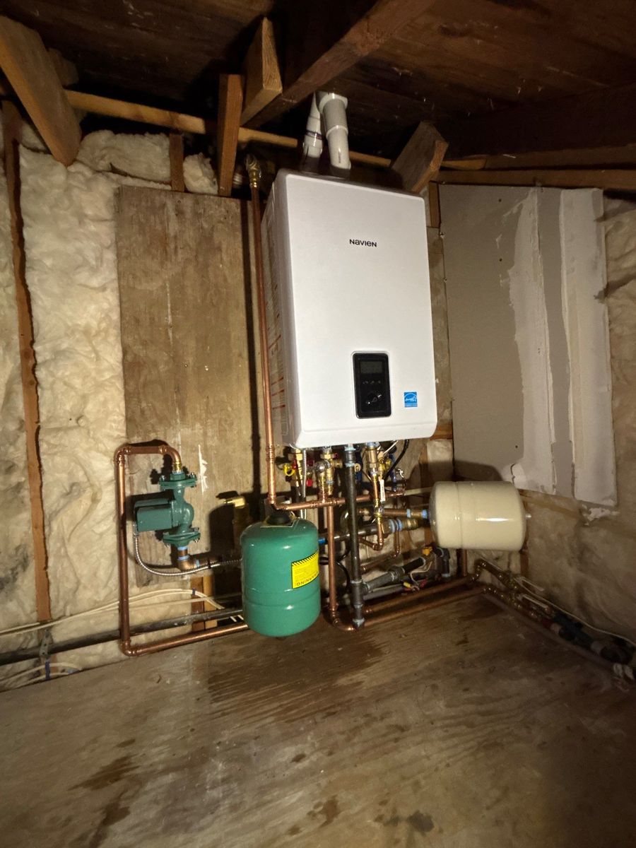 Navien high-efficiency combi boiler installed with copper piping and Taco circulator